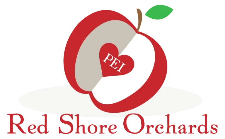 Red Shore Orchards Logo of a sliced apple revealing a heart with "PEI" inscribed in the middle. The text "red shore orchards" below.