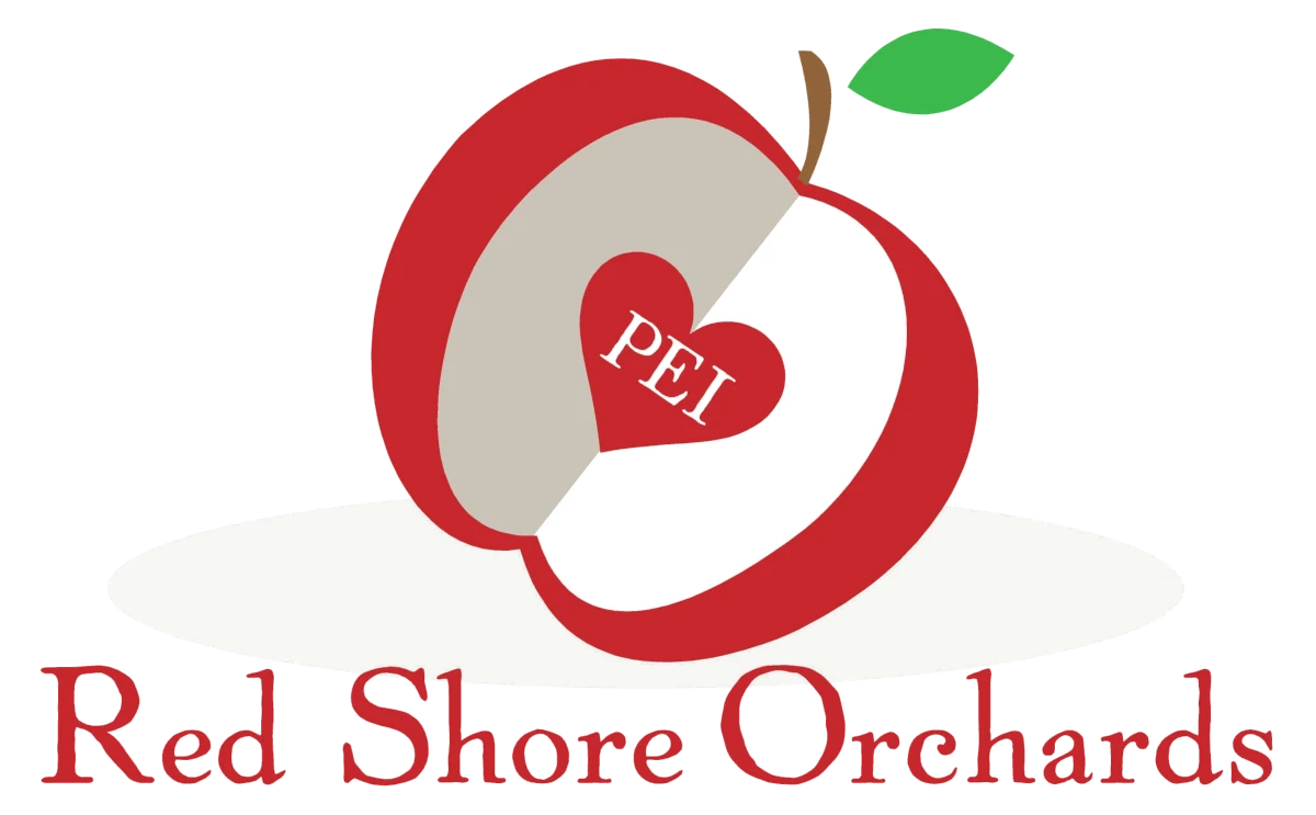 Red Shore Orchards Logo of a sliced apple revealing a heart with "PEI" inscribed in the middle. The text "red shore orchards" below.